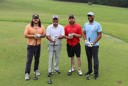 Whole Team Smiling on the course cropped-1